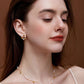Woman wearing SUIHE Jewelry "Candybean" Pearl Necklace with gold-plated chain, showcasing elegance and versatility.