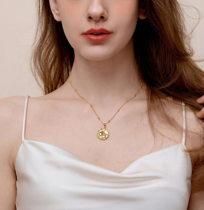 Model wearing SUIHE Jewelry 18K gold Pear Necklace with elegant design and gold bead accents, symbolizing simplicity and sophistication.