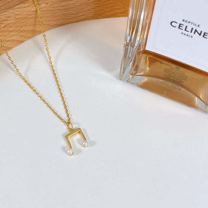 SUIHE Jewelry 'Melody' Necklace in 18k Gold Vermeil with freshwater pearls, showcasing delicate elegance and subtle charm.